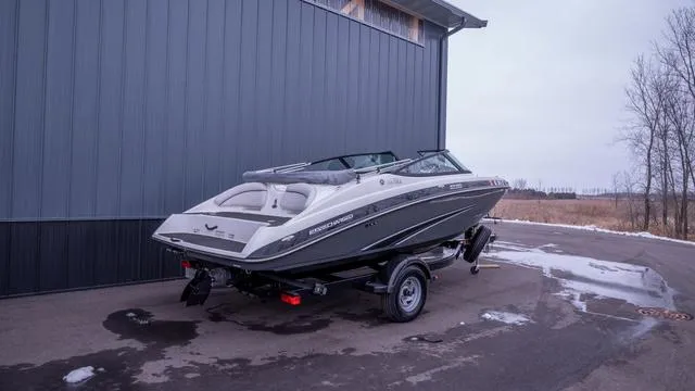 Slide: The Image of 2014 Yamaha SX192: Sleek motorboat with sporty design, parked on a trailer beside a building. - 3
