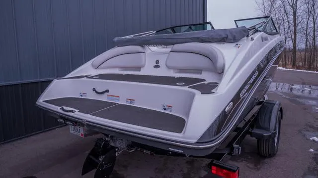 Slide: The Image of A 2014 Yamaha SX192 boat on a trailer beside a building. - 7
