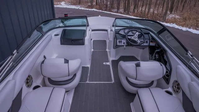 Slide: The Image of The image shows the cockpit of a 2014 Yamaha SX192 boat with gray seats and steering wheel. - 4