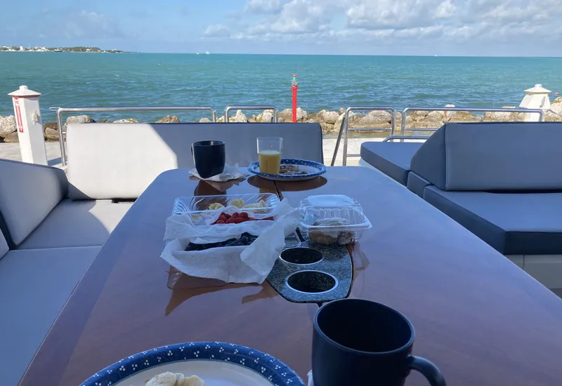 Slide: The Image of Breakfast setup on a 2006 Princess V70 yacht with ocean view. - 10