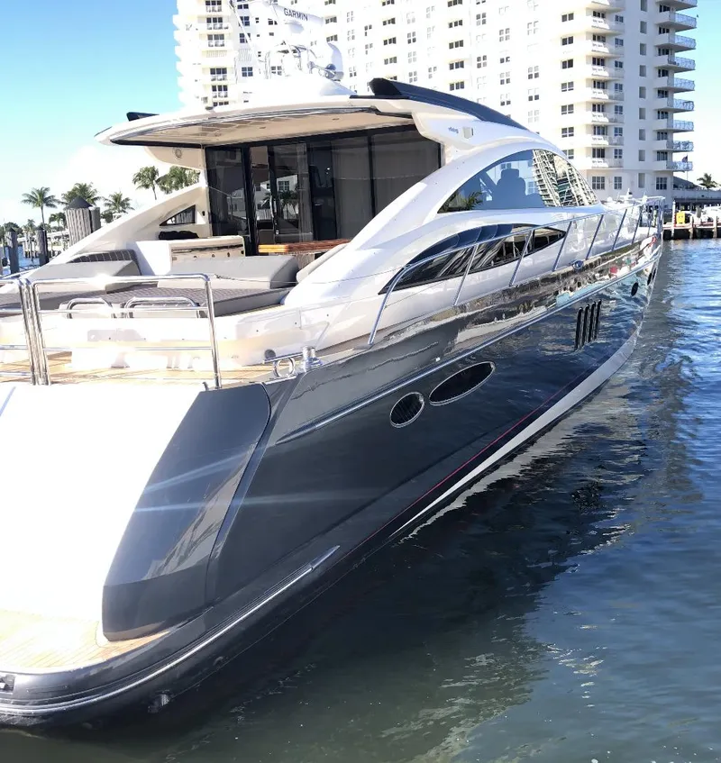 Slide: The Image of Luxury 2006 Princess V70 yacht docked near waterfront buildings. - 11
