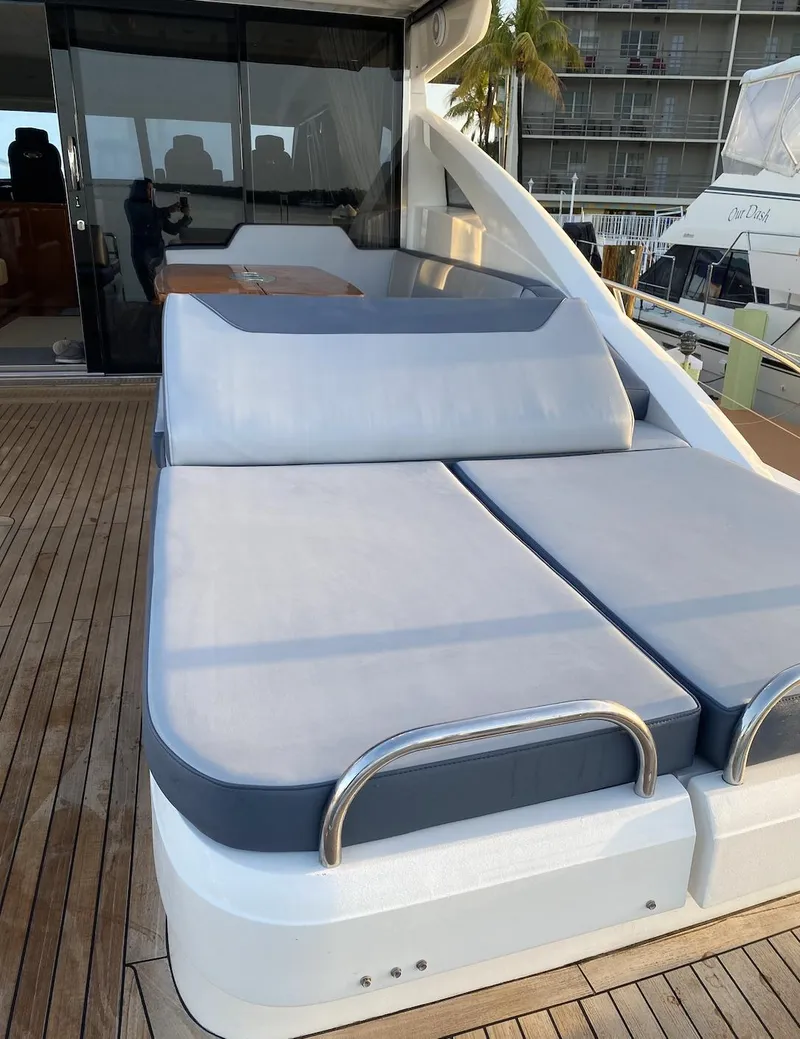 Slide: The Image of Luxury 2006 Princess V70 yacht with spacious sunbathing deck and sleek design. - 13