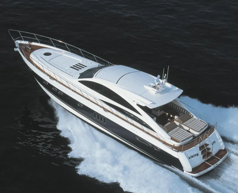 Slide: The Image of Luxury 2006 Princess V70 yacht cruising on open water. - 15
