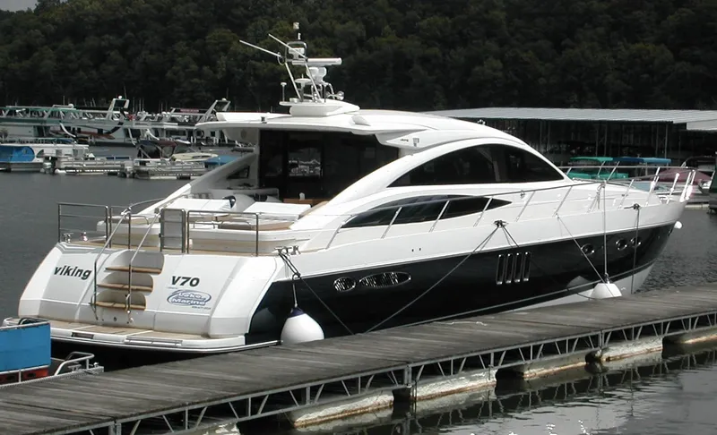Slide: The Image of Luxury 2006 Princess V70 yacht docked at marina. - 16