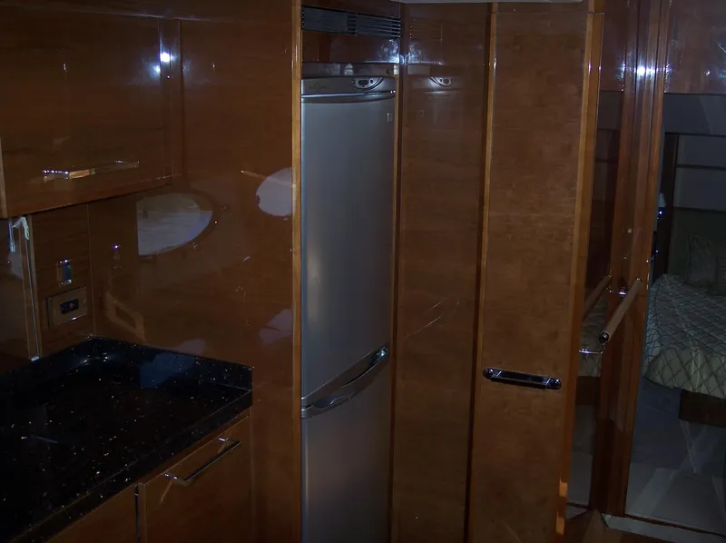 Slide: The Image of Luxurious wooden kitchen interior in a 2006 Princess V70 yacht. - 19