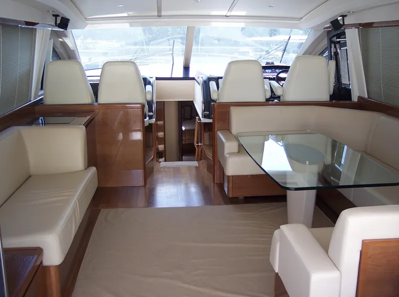Slide: The Image of Luxurious interior of 2006 Princess V70 yacht with elegant seating and glass table. - 21