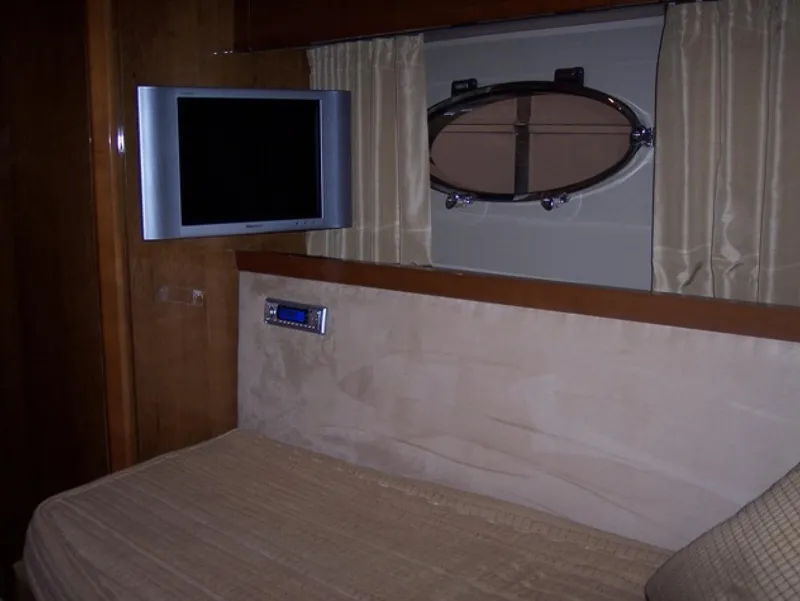 Slide: The Image of Interior of 2006 Princess V70 yacht with TV and porthole window. - 23