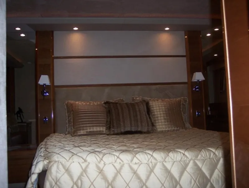 Slide: The Image of Luxurious bedroom interior of 2006 Princess V70 yacht with elegant bedding and lighting. - 26