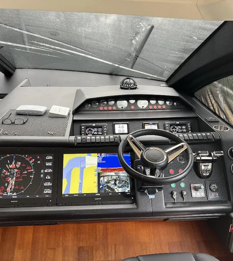 Slide: The Image of Cockpit of a 2006 Princess V70 yacht with navigation screens and controls. - 9