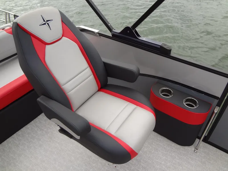 Slide: The Image of 2023 Berkshire 25UL STS 3.0+ boat seat with red and gray design, cup holders, on water. - 18