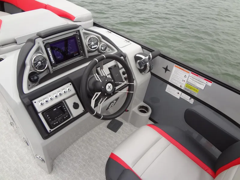 Slide: The Image of 2023 Berkshire 25UL STS 3.0+ boat dashboard with steering wheel and controls. - 21