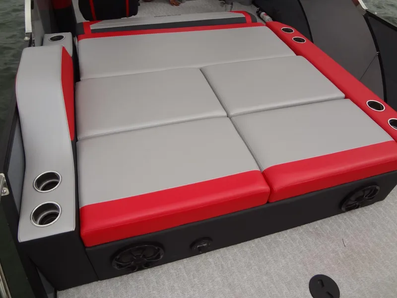 Slide: The Image of 2023 Berkshire 25UL STS 3.0+ boat seating with red and gray upholstery. - 29