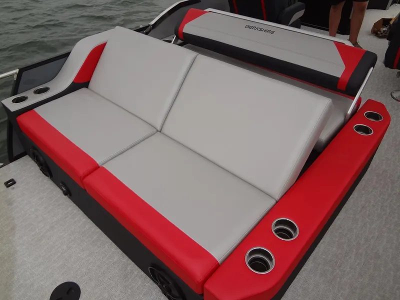 Slide: The Image of 2023 Berkshire 25UL STS 3.0+ boat seating with red and gray upholstery, cup holders. - 30
