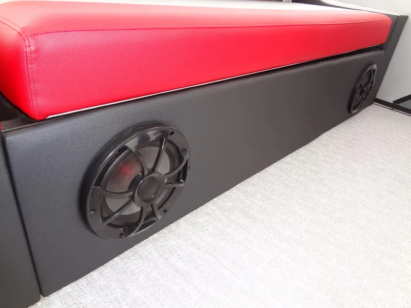 Slide: The Image of Red and black seating with speakers on a 2023 Berkshire 25UL STS 3.0+ boat. - 33