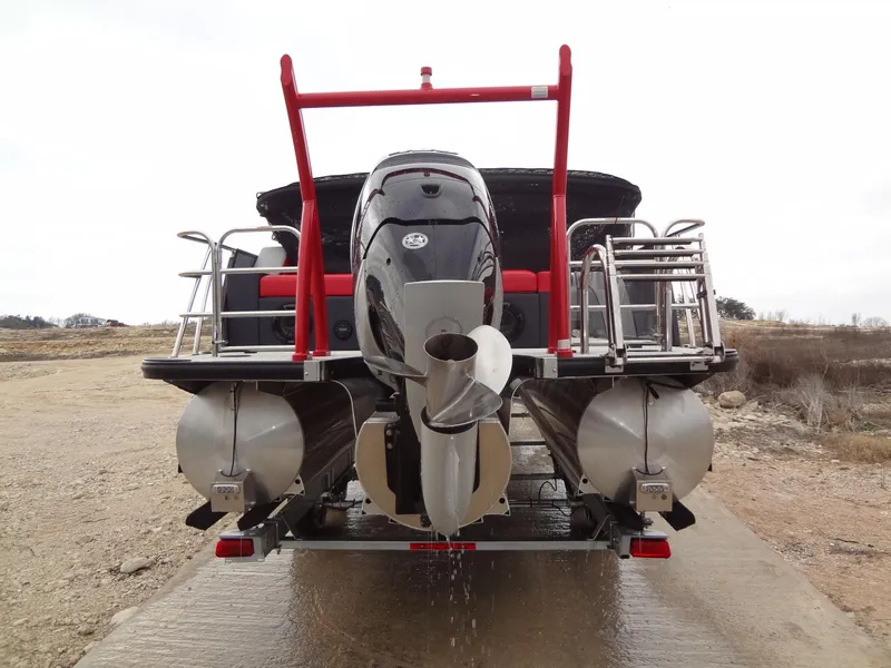 Slide: The Image of 2023 Berkshire 25UL STS 3.0+ pontoon boat rear view with motor and ladder. - 8