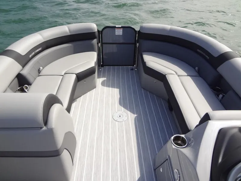 Slide: The Image of 2023 Berkshire 24UL CTS 3.0 pontoon boat interior with gray seating and striped flooring. - 11