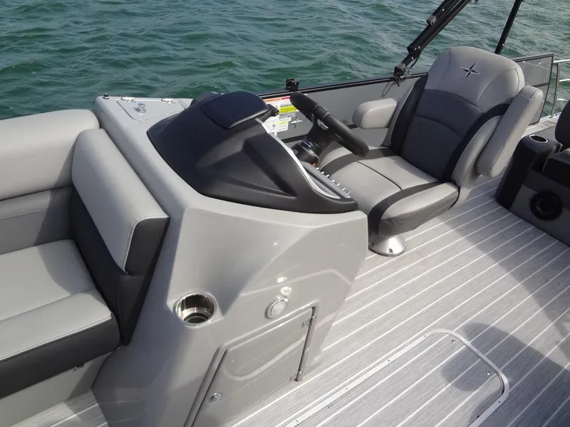 Slide: The Image of 2023 Berkshire 24UL CTS 3.0 boat interior with sleek gray seating and modern controls. - 16
