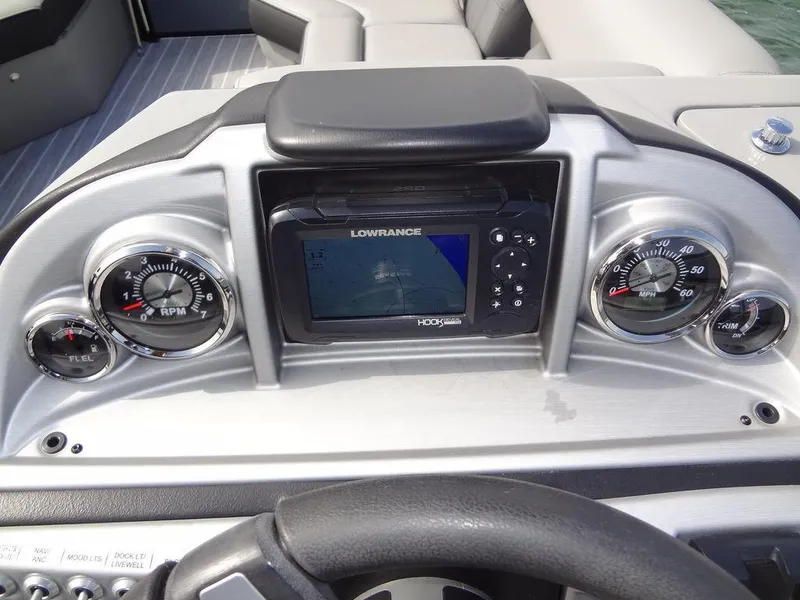 Slide: The Image of Dashboard of 2023 Berkshire 24UL CTS 3.0 with gauges and Lowrance display. - 19