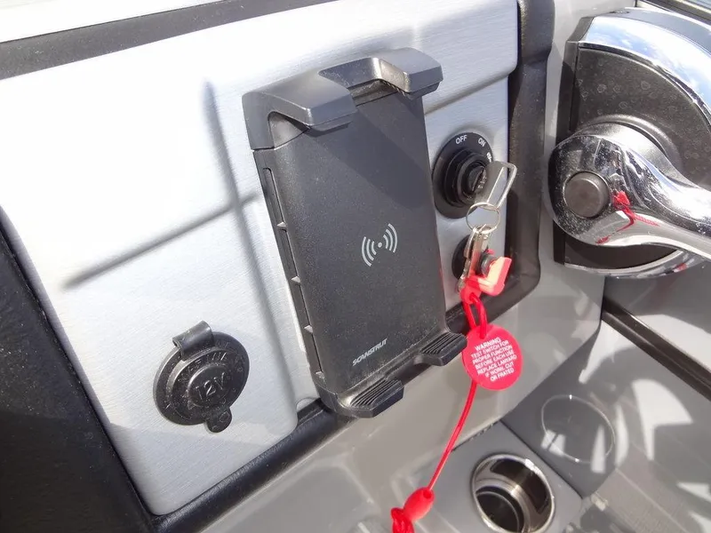 Slide: The Image of Dashboard of 2023 Berkshire 24UL CTS 3.0 with phone holder and ignition key. - 21