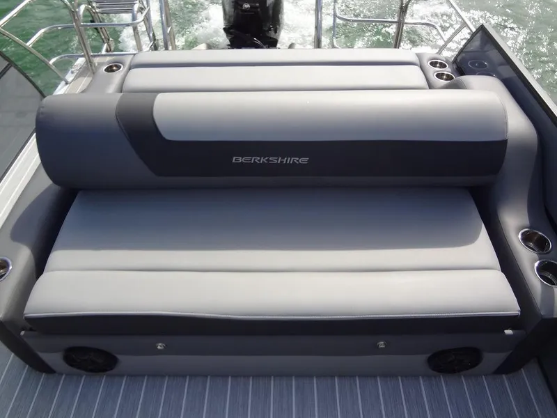 Slide: The Image of 2023 Berkshire 24UL CTS 3.0 boat seating with gray upholstery and cup holders. - 22