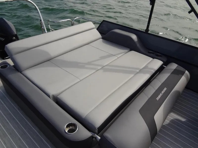 Slide: The Image of 2023 Berkshire 24UL CTS 3.0 boat with gray seating, on water. - 26