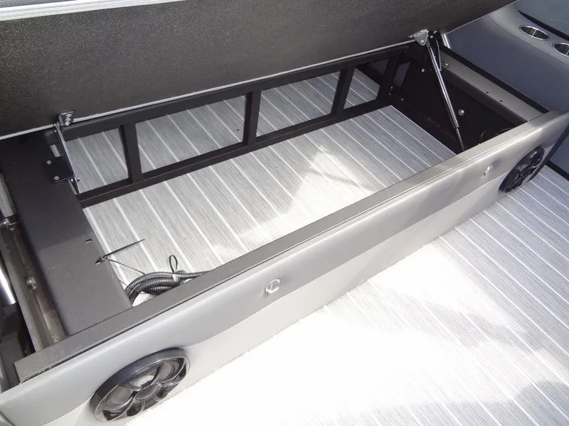 Slide: The Image of 2023 Berkshire 24UL CTS 3.0 boat interior storage compartment with open lid. - 31