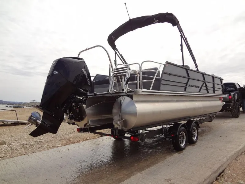 Slide: The Image of 2023 Berkshire 24UL CTS 3.0 pontoon boat on trailer, rear view. - 38
