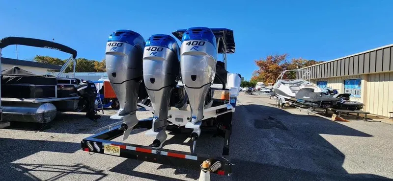 Slide: The Image of 2017 Nor-Tech 390 Center Console with triple 400R engines on trailer. - 3