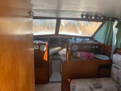 Slide: The Image of Interior of 1975 Chris-Craft 30 Tournament FB boat with wooden furnishings. - 10