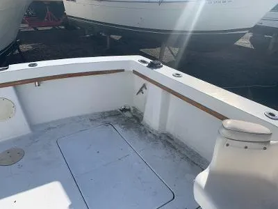 Slide: The Image of 1975 Chris-Craft 30 Tournament FB boat deck with storage hatch and seating. - 12