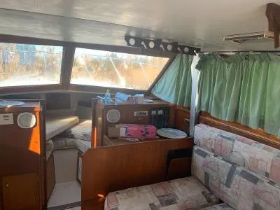 Slide: The Image of Interior of 1975 Chris-Craft 30 Tournament FB boat with seating and windows. - 14