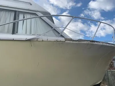 Slide: The Image of 1975 Chris-Craft 30 Tournament FB boat with visible hull damage. - 6