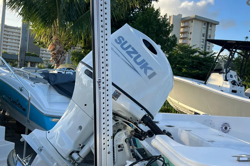 Slide: The Image of Piranha B2200 CASADOR 2023 with Suzuki outboard motor at marina. - 13