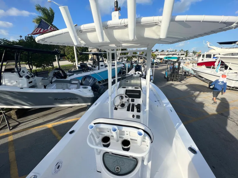 Slide: The Image of Piranha B2200 CASADOR 2023 boat at a dock under sunny skies. - 2