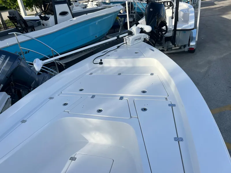 Slide: The Image of Piranha B2200 CASADOR 2023 boat deck with storage and motor. - 20