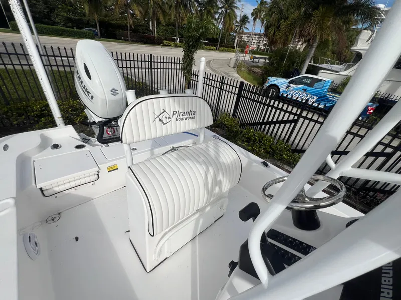Slide: The Image of Piranha B2200 CASADOR 2023 boat with white seating and controls. - 33