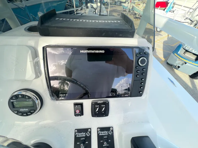 Slide: The Image of Piranha B2200 CASADOR 2023 with Humminbird display on dashboard. - 7