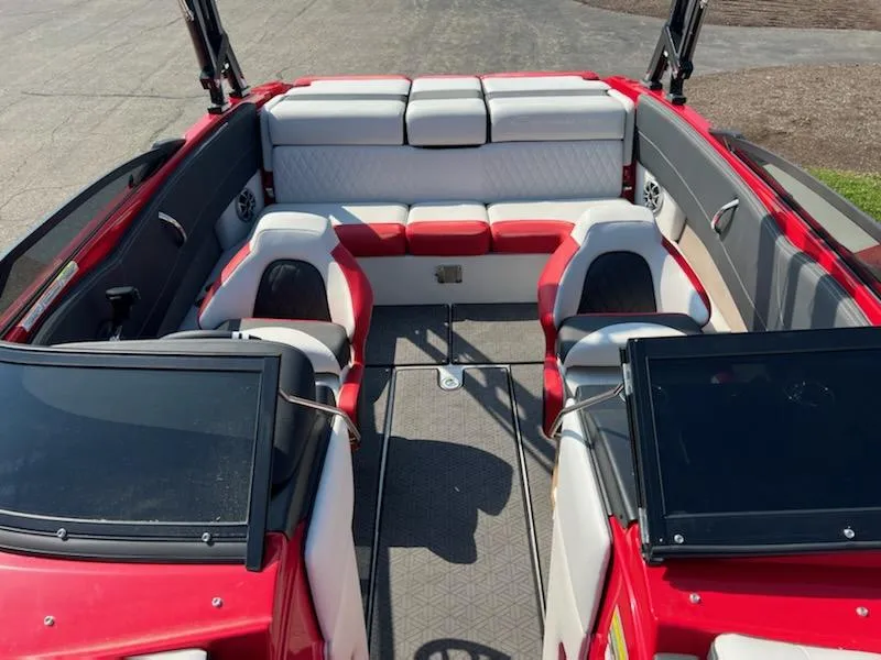 Slide: The Image of 2023 Crownline 240 SS boat interior with red and white seating. - 4