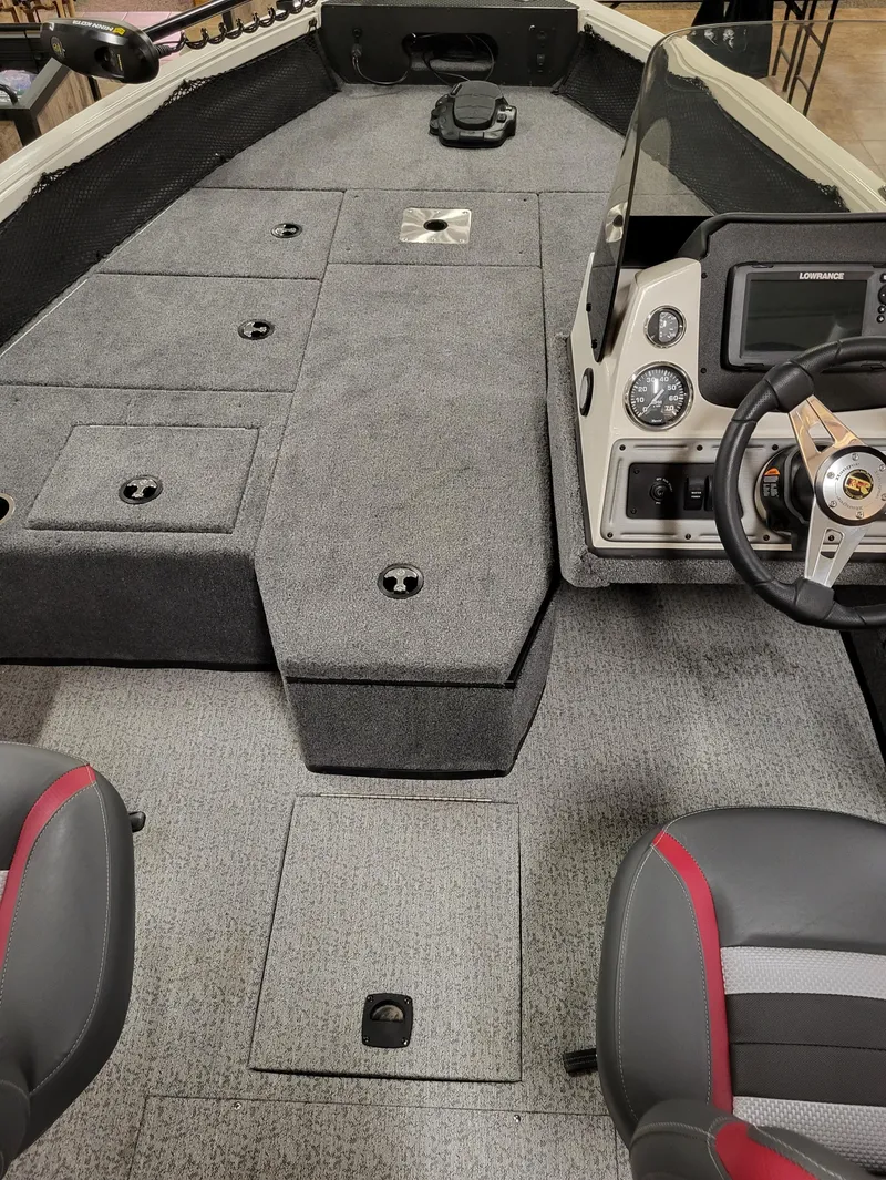 Slide: The Image of 2023 Ranger VS1682SC Angler boat dashboard with steering wheel and control panel. - 13