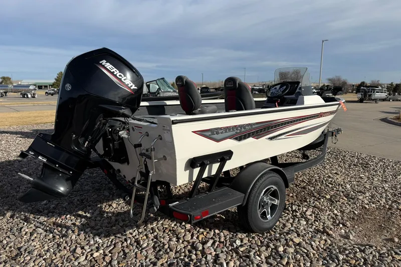 Slide: The Image of 2023 Ranger VS1682SC Angler boat with Mercury engine on trailer, parked outdoors. - 6
