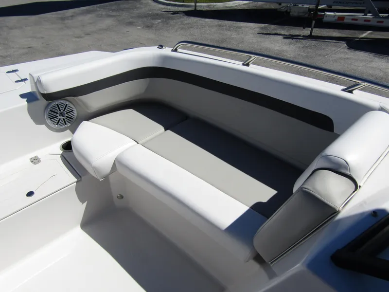Slide: The Image of 2023 Starcraft SVX 190 OB boat interior with cushioned seating and speaker. - 10
