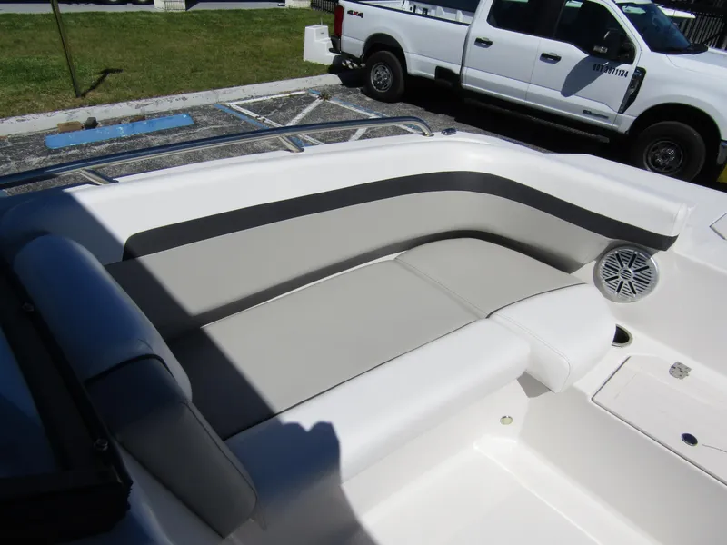 Slide: The Image of 2023 Starcraft SVX 190 OB boat interior with cushioned seating and speaker. - 11