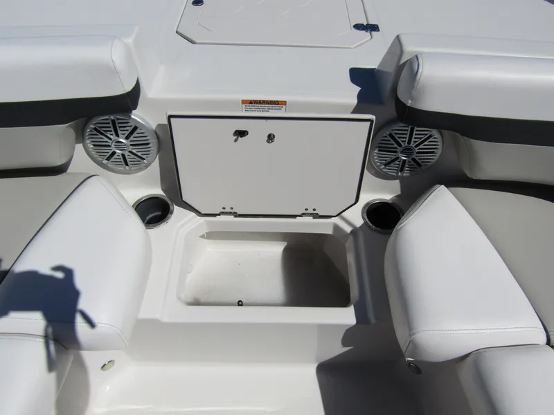 Slide: The Image of 2023 Starcraft SVX 190 OB boat interior with seating and storage compartment. - 14