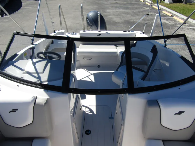 Slide: The Image of 2023 Starcraft SVX 190 OB boat interior with seating and steering wheel. - 16