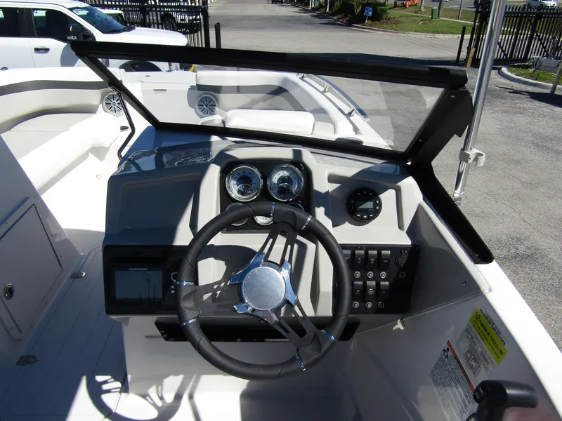 Slide: The Image of 2023 Starcraft SVX 190 OB boat dashboard with steering wheel and gauges. - 21