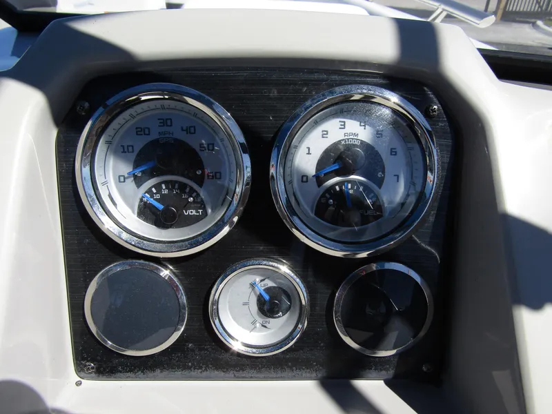 Slide: The Image of Dashboard of 2023 Starcraft SVX 190 OB boat with gauges and controls. - 23
