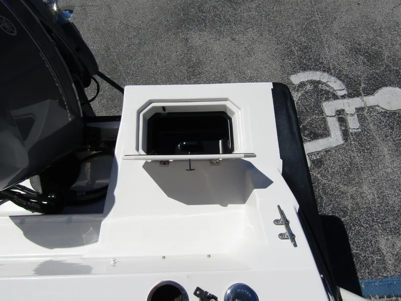 Slide: The Image of 2023 Starcraft SVX 190 OB boat detail showing storage compartment and engine area. - 34