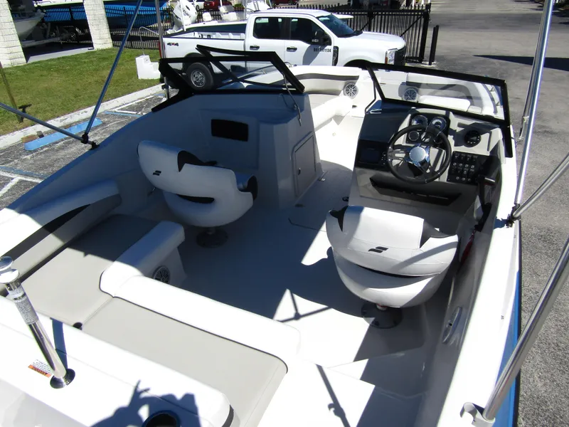 Slide: The Image of 2023 Starcraft SVX 190 OB boat interior with seating and steering console. - 36