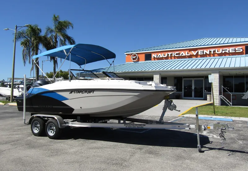 Slide: The Image of 2023 Starcraft SVX 190 OB boat on trailer at Nautical Ventures dealership. - 5