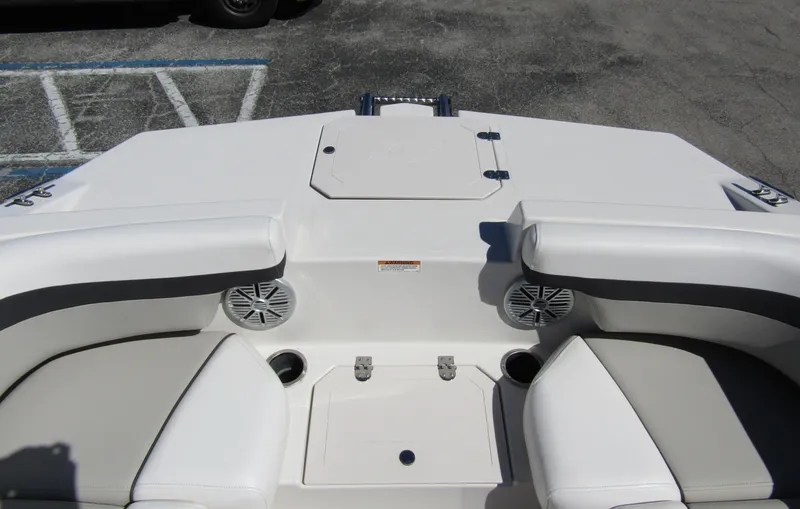 Slide: The Image of 2023 Starcraft SVX 190 OB boat interior with cushioned seating and speakers. - 7